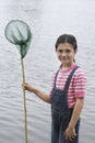 Happy Girl Holding Fishing Net By Lake Royalty Free Stock Photo