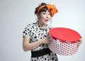 Happy girl holding gift box with red polka dots Royalty Free Stock Photo