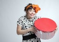 Happy girl holding gift box with red polka dots Royalty Free Stock Photo