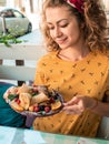 Happy girl having breakfast with pancakes with fruits Royalty Free Stock Photo