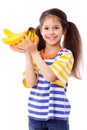 Happy girl holds a bunch of bananas Royalty Free Stock Photo