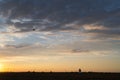 Happy girl holds a flying kite in a beautiful field at sunset. Having fun and freedom, healthy lifestyle