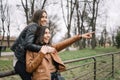 Happy girl hugging her female friend in the park Royalty Free Stock Photo