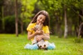 The happy girl is hugging her yorkshire terrier in the garden Royalty Free Stock Photo