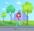 Happy girl joyfully runing and laughing in city park summer day. Concept of happiness and fun