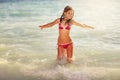 Happy girl jump on the sea waves Royalty Free Stock Photo