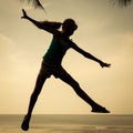 Happy girl jumping on the beach on the day time Royalty Free Stock Photo