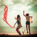 Happy girl jumping on the beach Royalty Free Stock Photo