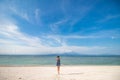 Happy girl jumping on the beach wit white sand. Tropical island Nusa Lembongan, Indonesia. Royalty Free Stock Photo