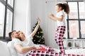 happy girl jumping on parent& x27;s bed on christmas Royalty Free Stock Photo