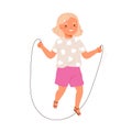 Happy girl jumping with skipping or jump rope. Little active kid having fun, doing cardio exercise. Healthy hobby and