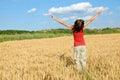 Happy girl jumping in wheat field Royalty Free Stock Photo