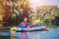 Happy girl kayaking on the river on a sunny day during summer vacation Royalty Free Stock Photo