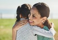 Happy, girl and kid hug mom at park for mothers day, love and relax outdoor for fun together in Colombia. Smile parent Royalty Free Stock Photo