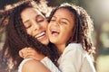 Happy girl kid hugging mom for mothers day, love and relax at park outdoors for fun together in Colombia. Smile parent Royalty Free Stock Photo