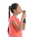 Happy girl kissing golden winning cup isolated on Royalty Free Stock Photo