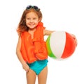 Happy girl in lifejacket with colored rubber ball