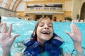 Happy girl in lifejacket in the water park Royalty Free Stock Photo