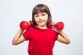 Happy girl lifting dumbbells for girl-boy fairness at sport