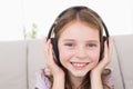 Happy girl listening music through headphones Royalty Free Stock Photo