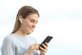 Happy girl listening music on phone with earphones Royalty Free Stock Photo