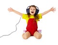 Happy girl listens to music with headphones Royalty Free Stock Photo