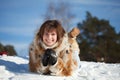 Happy girl lying down on snow Royalty Free Stock Photo