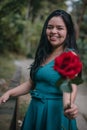 Happy girl in the middle of a bridge with rose in hands Royalty Free Stock Photo