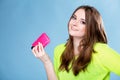 Happy girl with mobile phone in pink cover Royalty Free Stock Photo