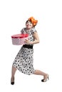 Happy girl opening gift box with red polka dots Royalty Free Stock Photo