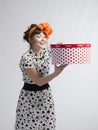 Happy girl opening gift box with red polka dots Royalty Free Stock Photo