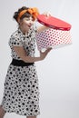 Happy girl opening gift box with red polka dots Royalty Free Stock Photo