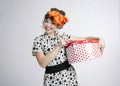 Happy girl opening gift box with red polka dots Royalty Free Stock Photo