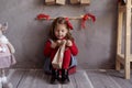 Happy girl opening package with advent calendar on Christmas eve, child sitting on floor in children& x27;s room with craft Royalty Free Stock Photo