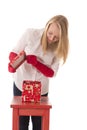 Happy girl opens a box with a gift Royalty Free Stock Photo
