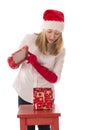 Happy girl opens a box with a gift Royalty Free Stock Photo