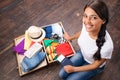 Happy girl packing her suitcase Royalty Free Stock Photo