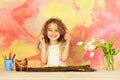 Happy girl painter with pencil, easter egg and tulip flowers Royalty Free Stock Photo