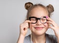 Happy girl in paper eyeglasses mask studio portrait Royalty Free Stock Photo