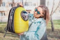 Girl pet owner smiles in the Park walking with her cat. Friendship and cat carrier. Lifestyle and recreation Royalty Free Stock Photo