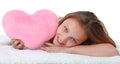 Happy girl with pink heart pillow Royalty Free Stock Photo