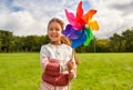 happy girl with pinwheel at summer park Royalty Free Stock Photo
