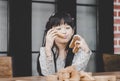 Happy girl playing building a wooden toy block tower collapsi Royalty Free Stock Photo