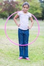 happy girl playing with hula hoops Royalty Free Stock Photo