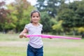 happy girl playing with hula hoops Royalty Free Stock Photo