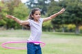 happy girl playing with hula hoops Royalty Free Stock Photo