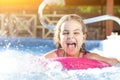 Happy girl playing in swimming pool Royalty Free Stock Photo