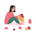 Happy girl plays with toy cubes and sitting on floor scene Royalty Free Stock Photo