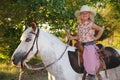 Happy girl with pony. Royalty Free Stock Photo