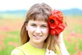 Happy girl in the poppy field